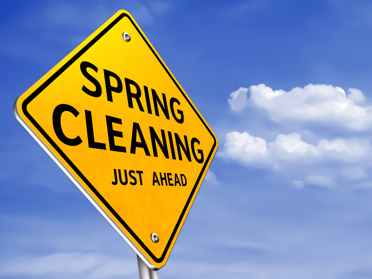 Spring Cleaning road sign with a background of blue skies 