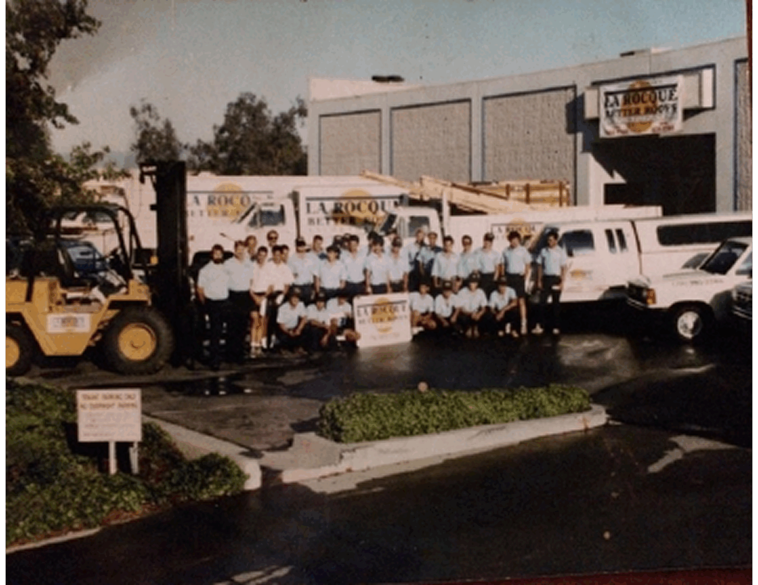Employees gathered in front of building
