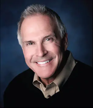 Older man with gray hair smiling